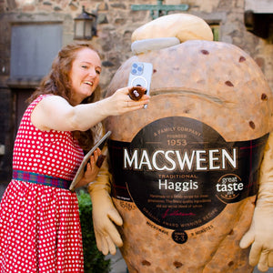 Alison Grieve and Hamish the Haggis are taking a selfie with iPhone 13 Pro and Hamish the Haggis Phone Holder